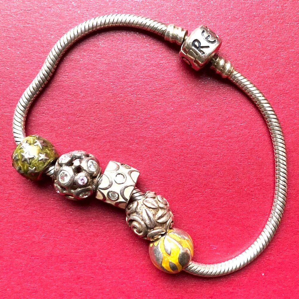 Sterling slver charm bracelet signed Moress